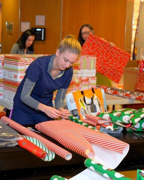 a woman wrapping a present